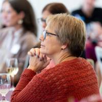 faculty listening at table